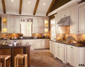 Mixing finishes like American Woodmark&rsquo;s Savannah Maple Butterscotch on the main cabinetry and Savannah Cherry Chocolate on the island is an easy way to add depth and color to any kitchen design.