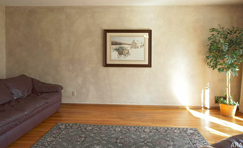Without a fireplace, this room feels ordinary, cold and empty.
