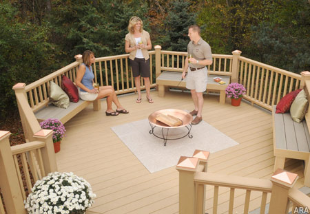 Slip-resistant, splinter free Latitudes composite decking and natural deck stones add a touch of class and safety around pools, grilling areas and raised fire pits.